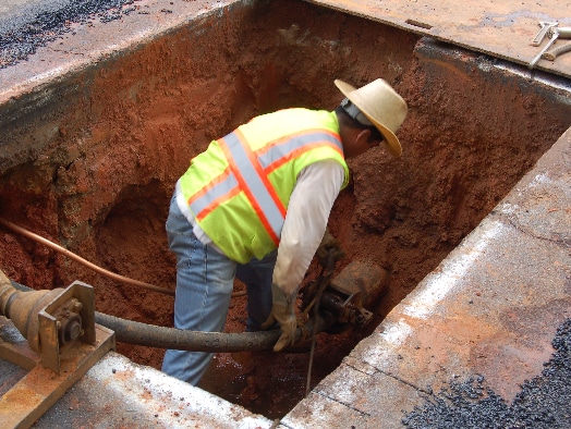 WaterLine being applied to a pipe at the bottom of a hole