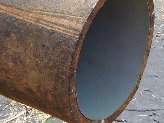 Waterline being applied to the inside of a pipe for protection