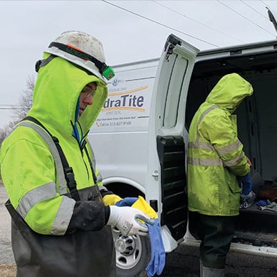 HydraTech Field Technicians preparing to install HydraTite despite the freezing water