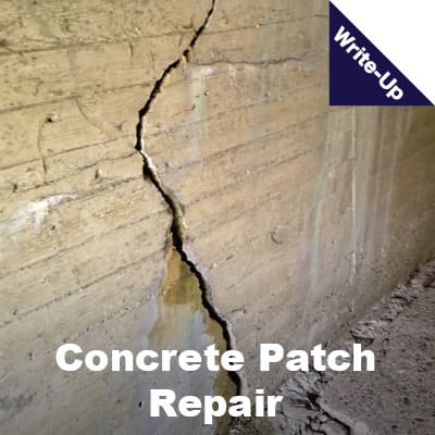 concrete with a large crack running through it. 'Concrete Patch Repair'