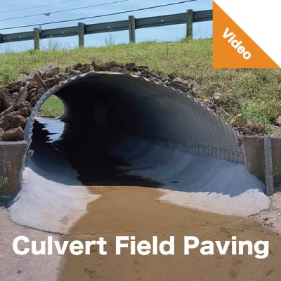 A culvert under a roadway with its invert paved. 'Field Culvert Paving'