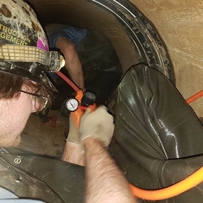 Close-up of a Field Service technician air testing a HydraTech Seal Field Service technician air testing a HydraTech Seal