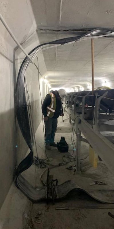 Installing a HydraTite Seal over a joint and around a conveyer