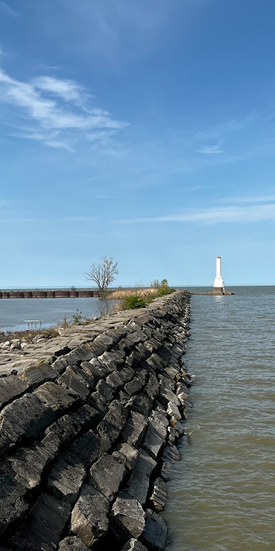 a light house off of the edge of Lake Erie