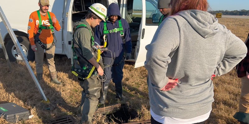 Inspecting a culvert's air quality for safety of the crew that will be entering