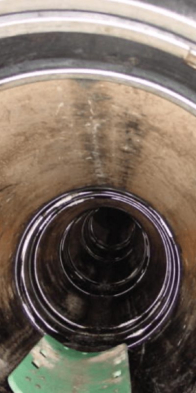 Looking down a pipe in which HydraTite has been installed over the joints