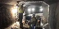 HydraTite being installed by two technicians in a box culvert
