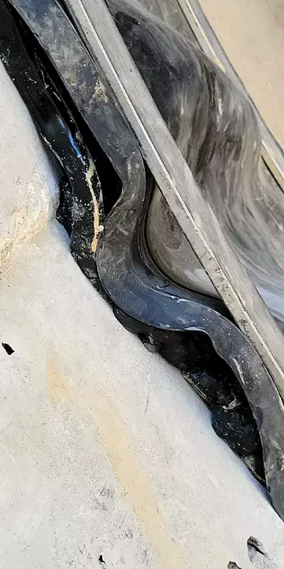 Three images, Technicians preparing to install HydraTite, Rubber and steel positioned over a joint, HydraTite installed with three bands