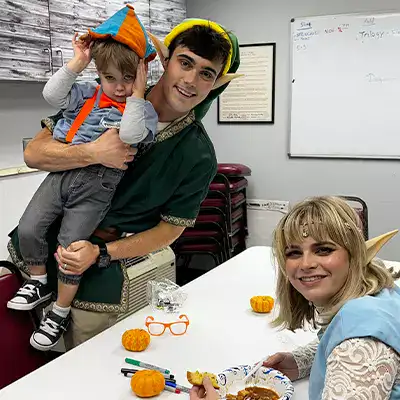 Three people dressed up for halloween