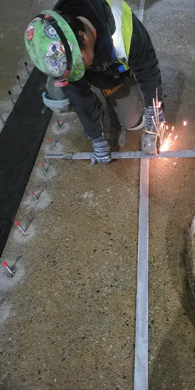 A Technician Cutting A Retaining Band In The Field