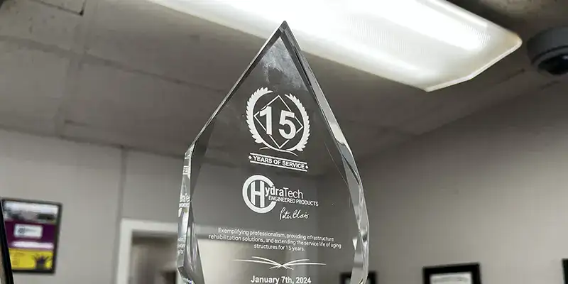 A glass award marking 15 years of a company being in service