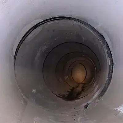A hole near the crown of a pipe