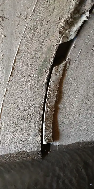 Grout falling out of a joint in a culvert pipe