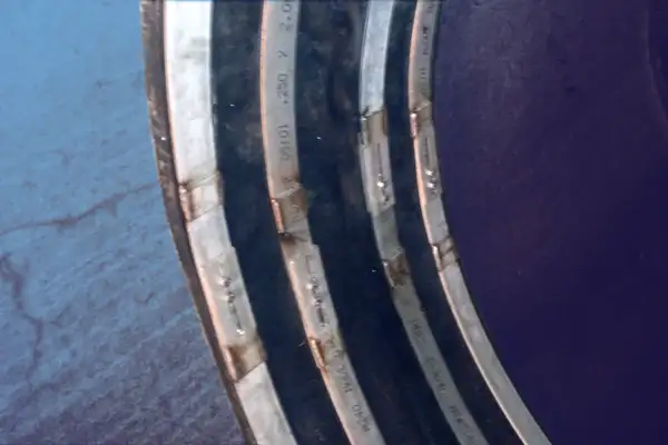 HydraTite installed over a joint in a pipe with four retaining bands