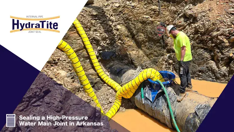 A winch connected to an excavator to lower a technician into a pipe, 'Sealing a High-Pressure Water Main Joint in Arkansas'