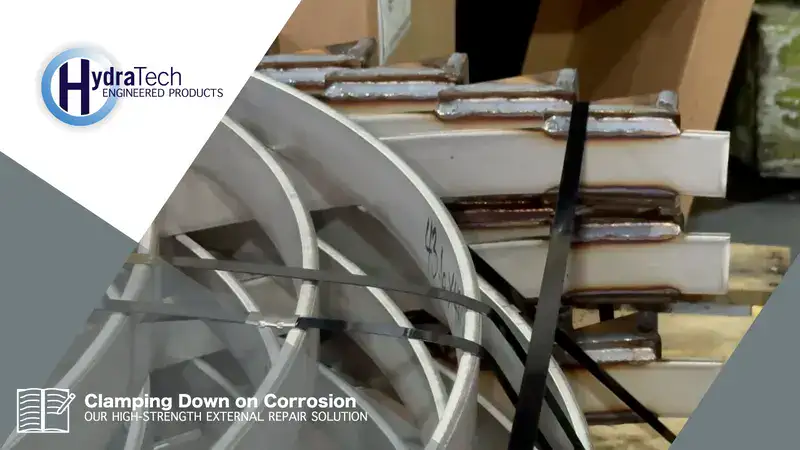 A stack of steel on a shipping pallet, 'Clamping Down On Corrosion: Our High-Strength External Repair Solution'