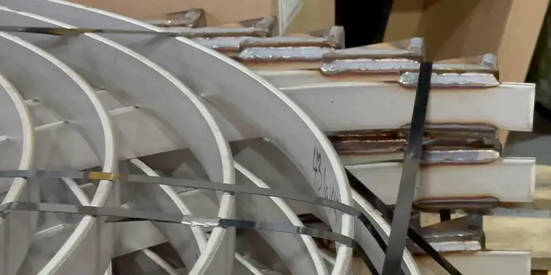 A portion of a bridge's support that has been wrapped in carbon fiber fabric to strengthen it