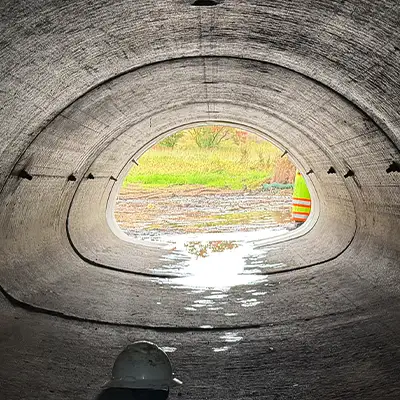 Irregularly-Shaped Culvert Looking out of an irregularly-shaped pipe