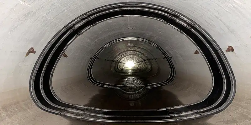 Several HydraTite seals installed over joints in an irregularly-shaped pipe