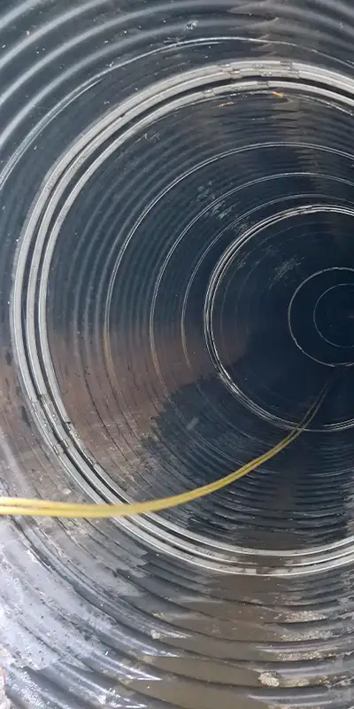 HydraTite sealing over two joints in a corrugated pipe