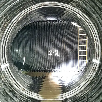 HydraTite installed over a joint in a large corrugated pipe to eliminate leaks