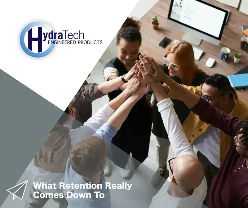 People in a group with their hands together, 'What Retention Really Comes Down To'