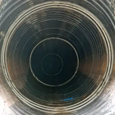 Two joints in a corrugated pipe that have been repaired using HydraTite