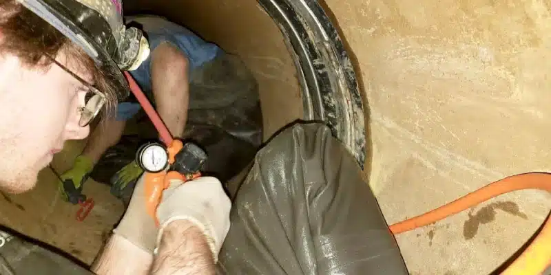 A technician completing an air test on a HydraTite seal