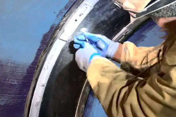 A technician opening an air port test valve on a HydraTite seal