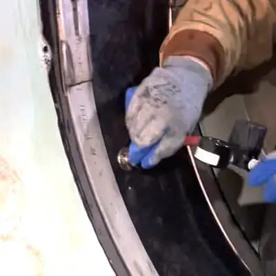 A technician connecting an air pump to a HydraTite seal