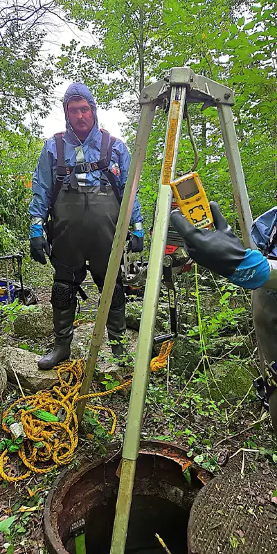 Technician preparing to enter the waste water pipe