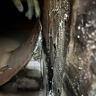 A corner form not sitting flush with the interior of the box-shaped flume