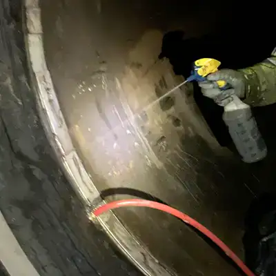 Air Testing A HydraTite Seal By A Technician Spraying Soaping Water