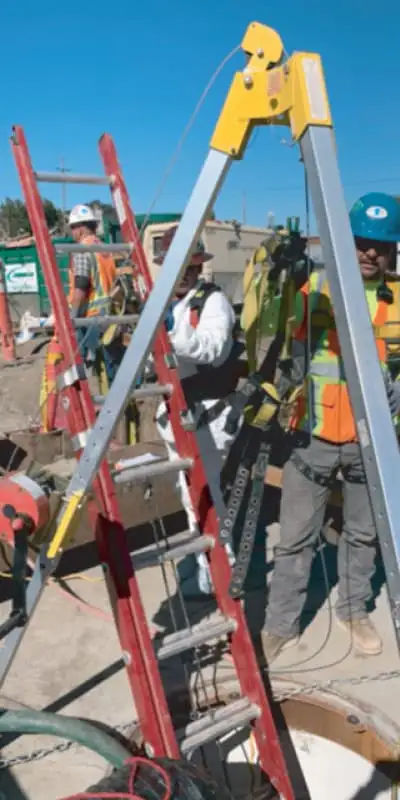 A ladder leading down into a pipe