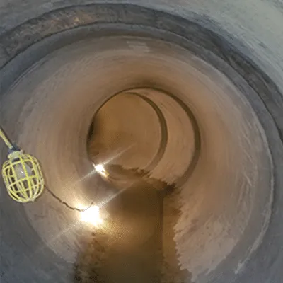 A string of lights inside a large-diameter pipe