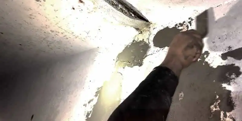 Concrete patches applied to the interior wall of a box-shaped flumes