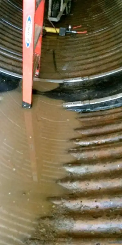 A HydraTite seal installed over a joint in a corrugated metal pipe