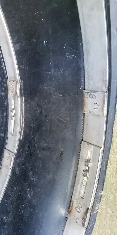 A double-wide seal installed with three retaining bands over a severely deteriorated joint