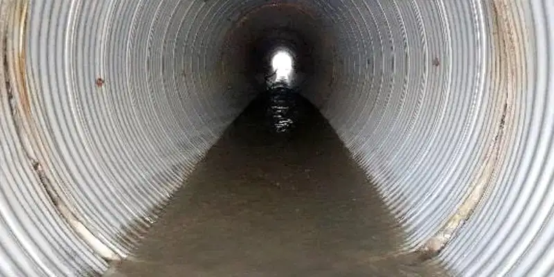 A separated joint in a corrugated metal pipe