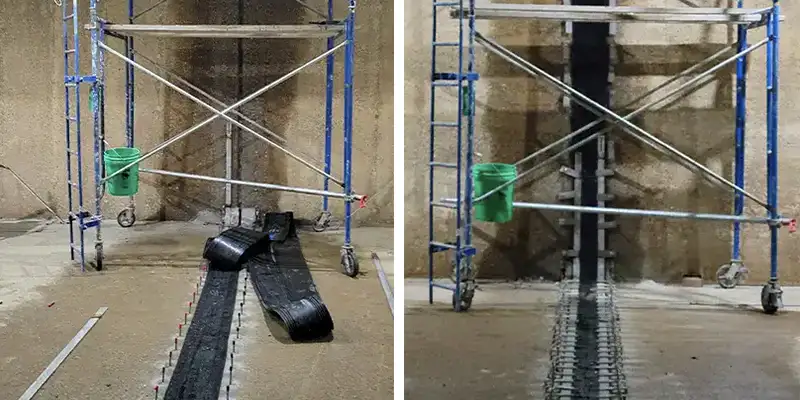 Scaffolding being used to seal over a joint in a box-shaped water basin