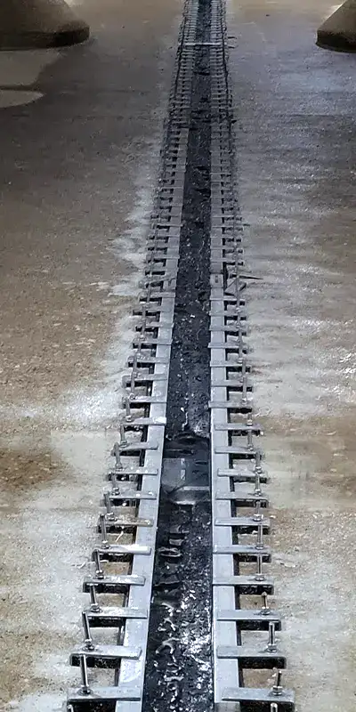 A large joint sealed utilizing HydraTite in a massive water basin