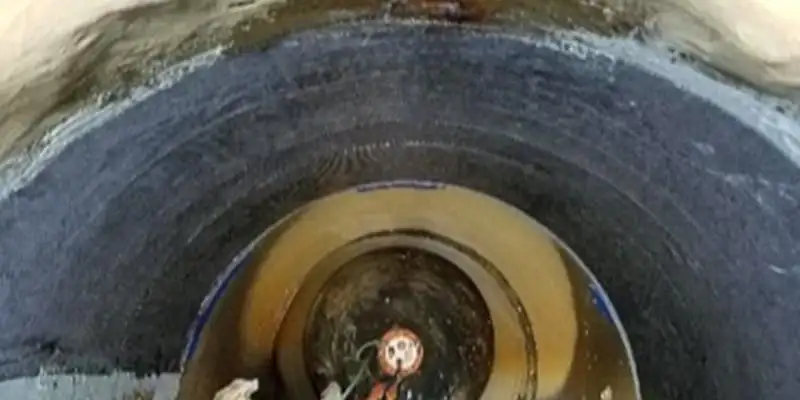 A portion of a pipe's interior that has been wrapped with HydraWrap