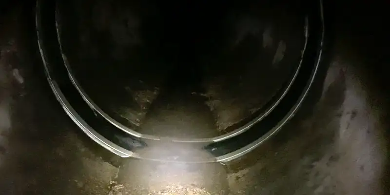 Inspecting the invert of a pipe that has had HydraTite installed over a joint