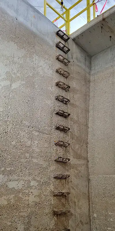 A ladder leading out of a large water basin