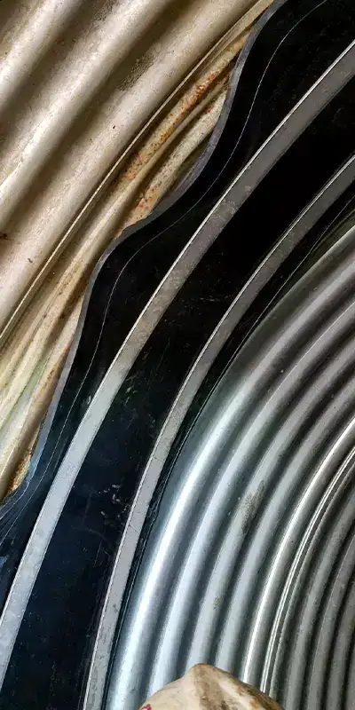 A HydraTite rubber seal loosely positioned over a joint in a corrugated pipe