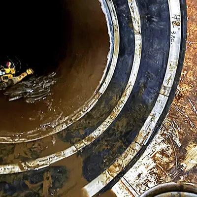 A double-wide seal installed inside a raw water pipe