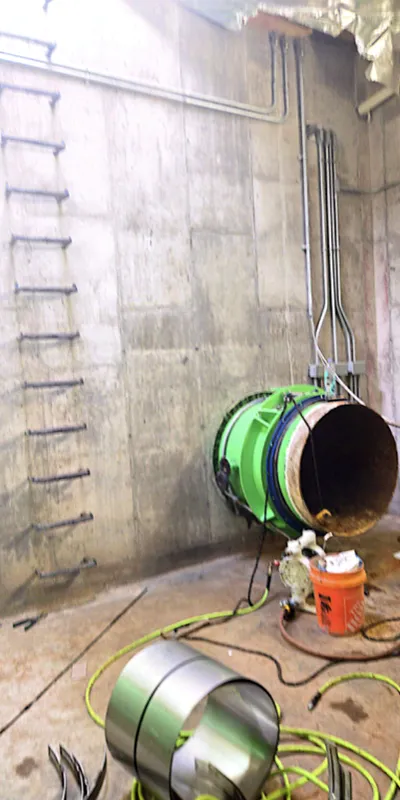 An entrance to a steel raw water pipe