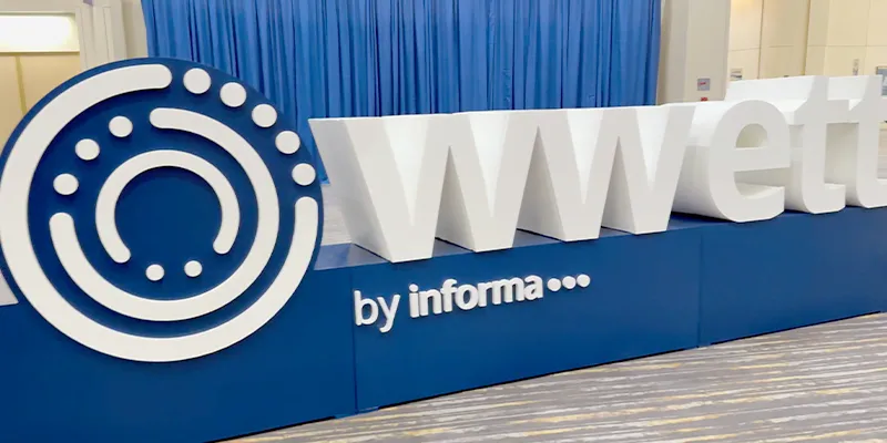 A large white and blue WWETT sign