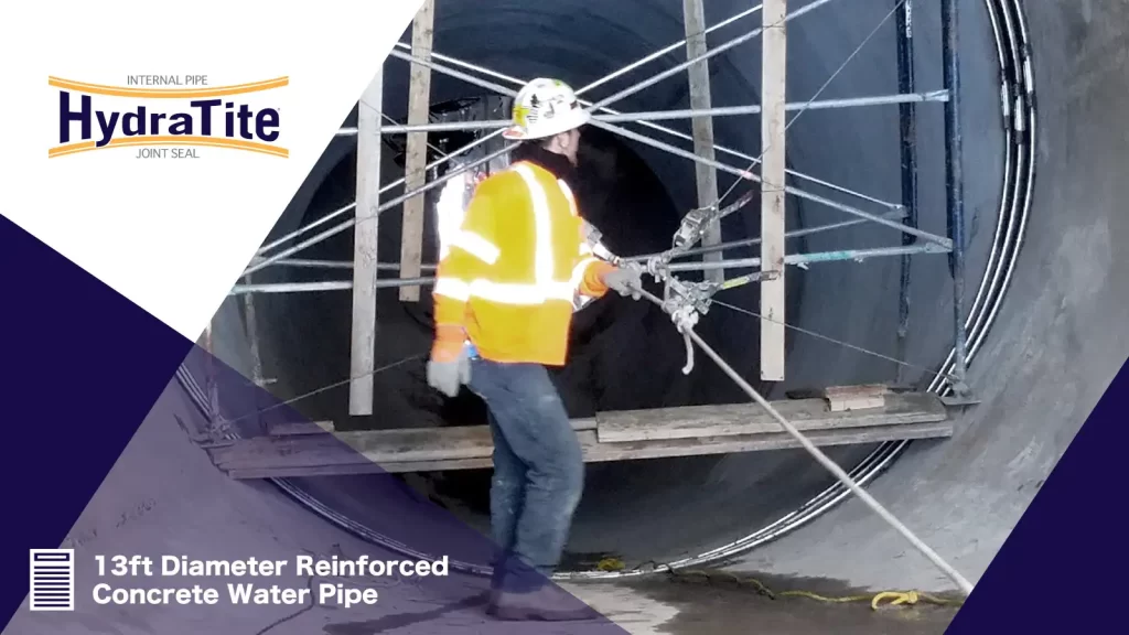 A technician looking back at a joint in a large-diameter pipe that has been sealed with HydraTite