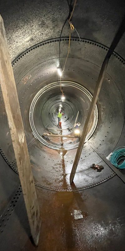 HydraTite seals being installed inside a large-diameter penstock pipe